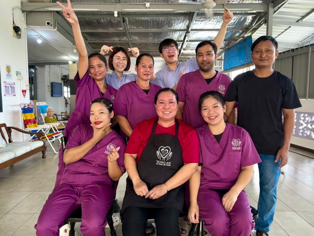 A vibrant group photo of Yong An’s caregiving team, radiating energy, unity, and dedication. Their cheerful spirit and close bond reflect the passion they bring daily to elderly care.
